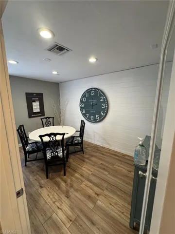 Conference room featuring hardwood / wood-style floors