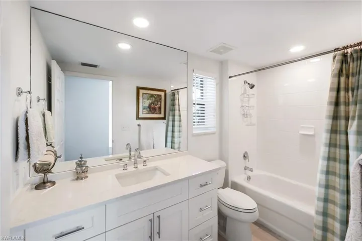 Remodeled En-Suite Guest Bath with Quartz topped Vanity
