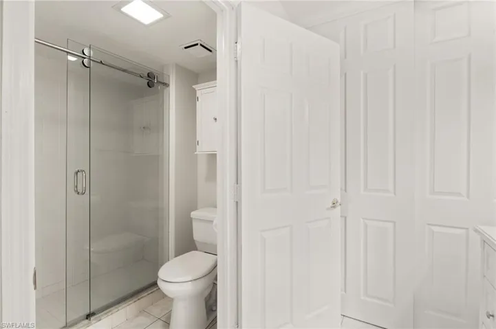 Master Bathroom with Tile and Glass Shower Doors