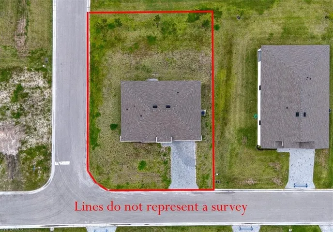 Corner lot property featuring a single-story residence with a gabled roof