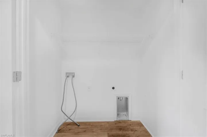 Dedicated laundry area with a wire storage shelf
