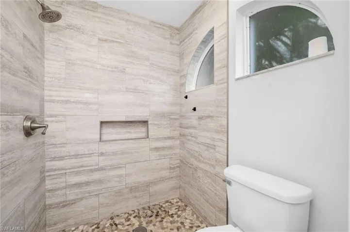 Bathroom with a tile shower