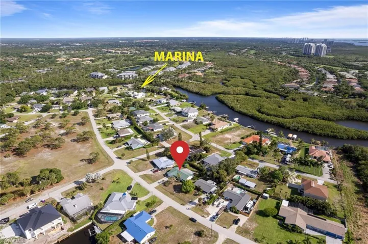 Aerial perspective highlighting proximity to nearby waterway and community dock