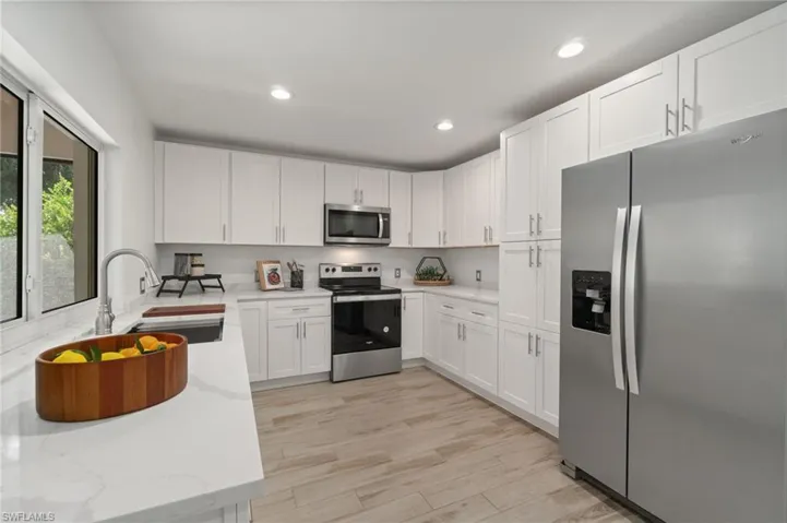 Modern kitchen with brand new stainless steel  appliances and clean finishes