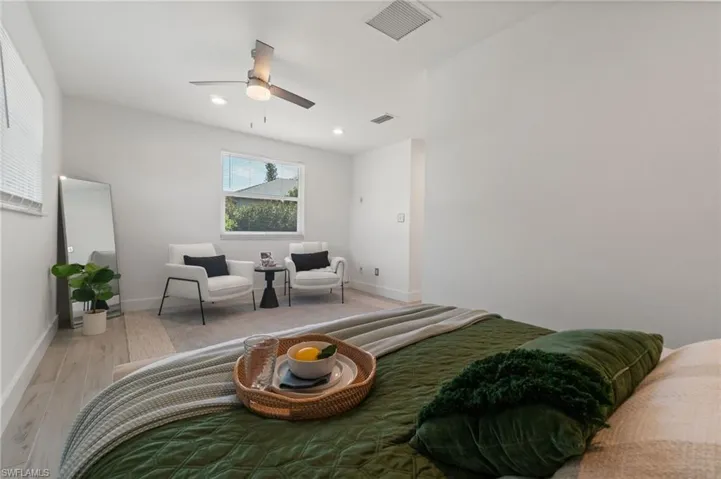 Primary bedroom featuring generous space and peaceful setting