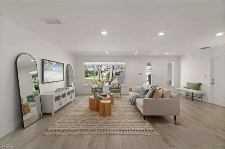 Spacious living room filled with natural light and an open layout