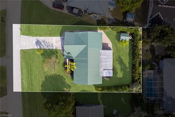 Aerial view showcasing the property layout and surrounding grounds