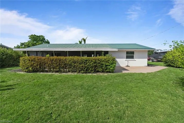 Expansive backyard with lush green space and privacy