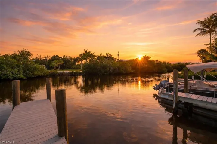 Community dock with direct water access, ideal for boating and sunset views