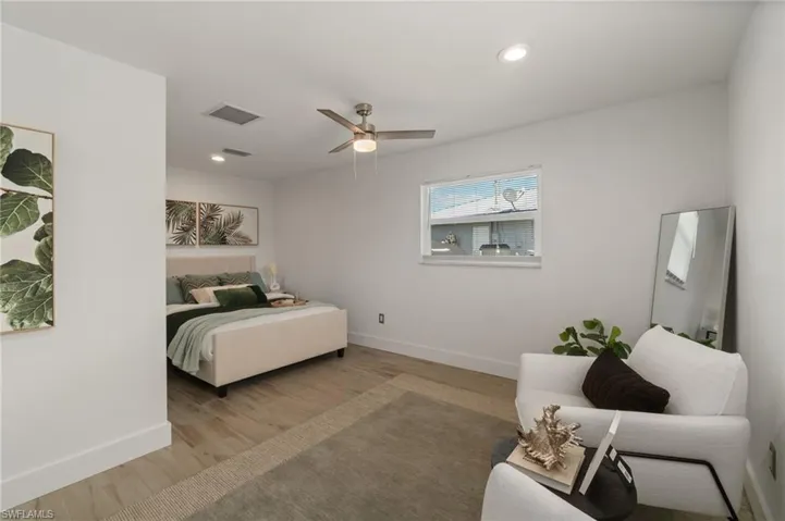 Well sized primary bedroom with clean design and abundant light