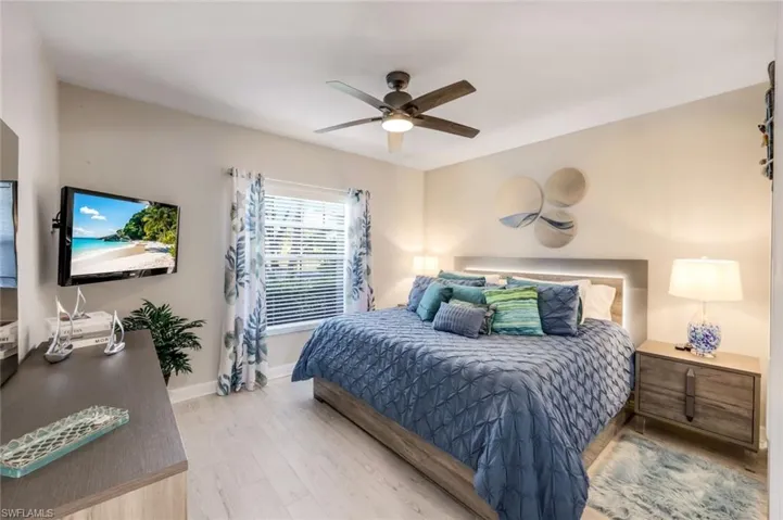Bedroom featuring light wood-style floors and a ceiling fan
