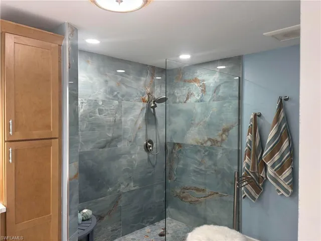 Full bath with a walk in shower and recessed lighting