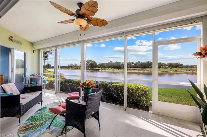 Sunroom featuring ceiling fan, a water view, and an outdoor hangout area