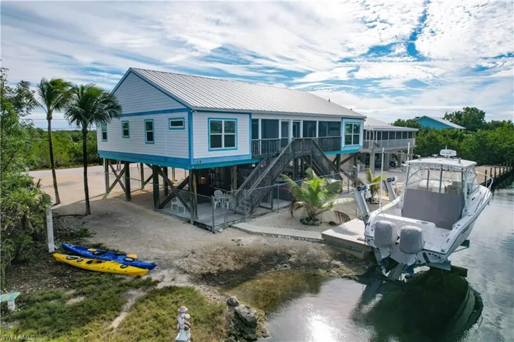 side view of property with boat ramp