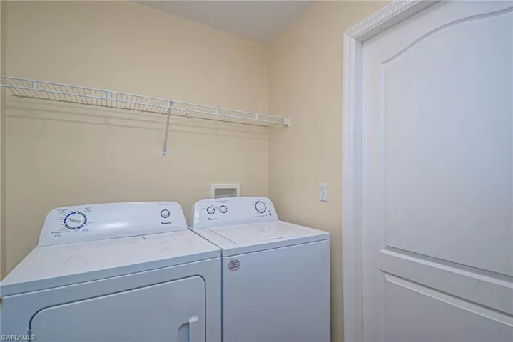 Clothes washing area with washing machine and clothes dryer