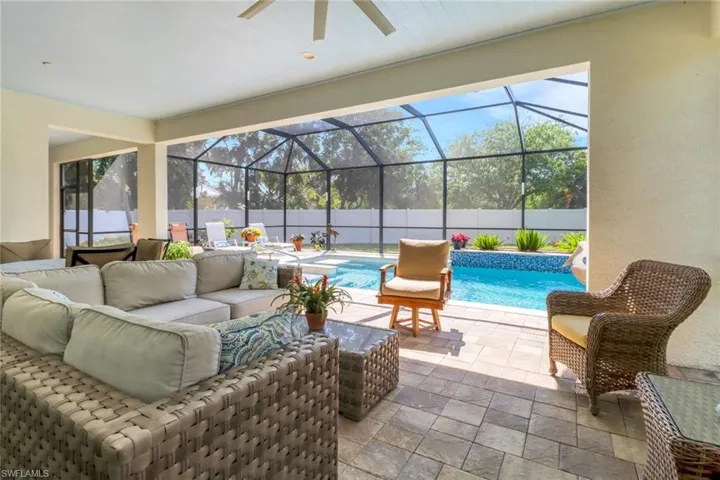 View of patio / terrace with a fenced backyard, a lanai, and an outdoor living space