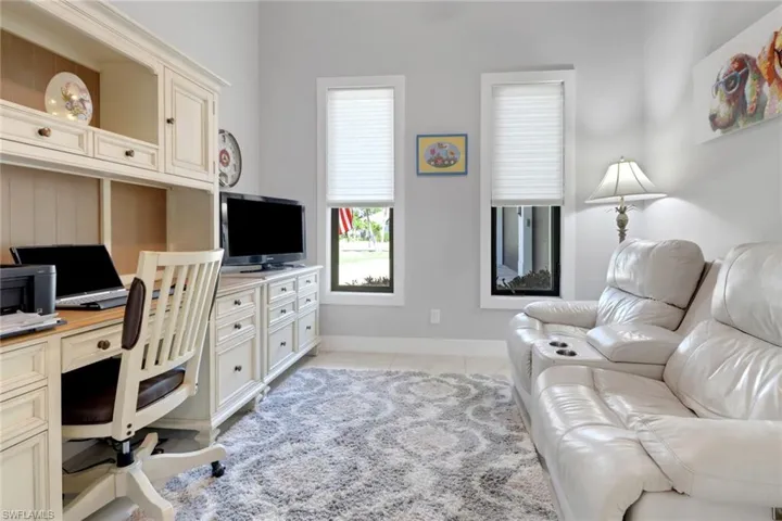 Home office featuring baseboards and light tile patterned floors