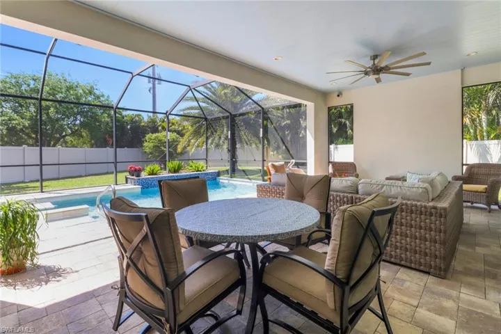 View of patio / terrace featuring outdoor lounge area, a fenced backyard, a lanai, outdoor dining space, and ceiling fan