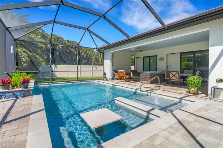 View of swimming pool featuring an outdoor hangout area, fence, a patio, a fenced in pool, and ceiling fan
