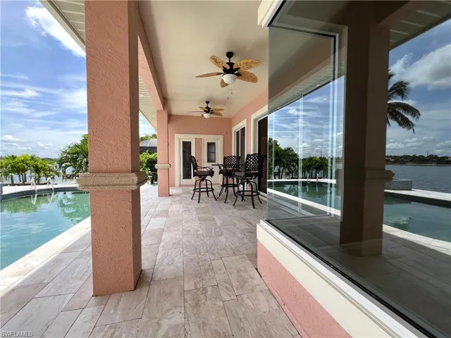 View of patio / terrace with ceiling fans