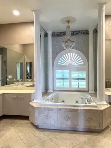 Downstairs Master Bath Arched Jacuzzi tub w custom chandelier