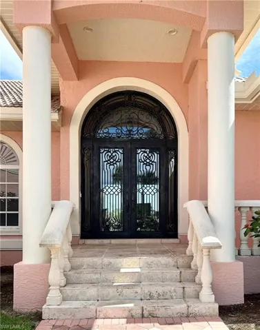 View of exterior entry with oversized double doors