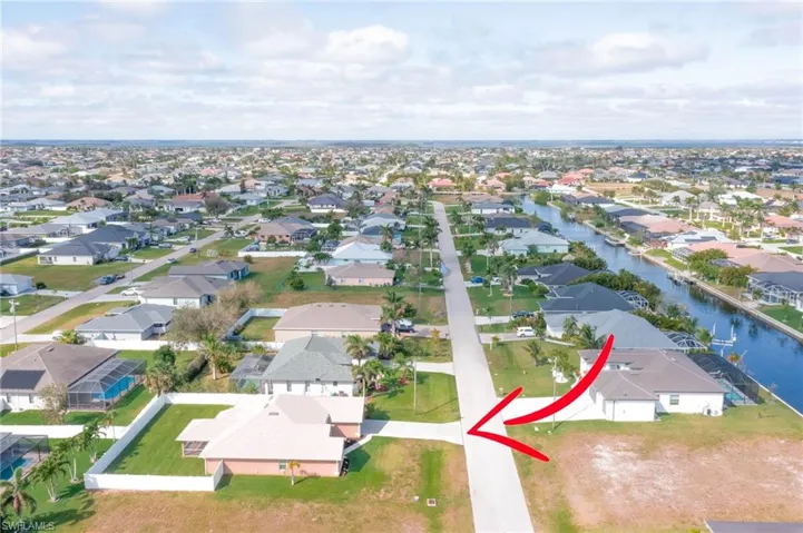 Drone / aerial view featuring a residential view and a water view