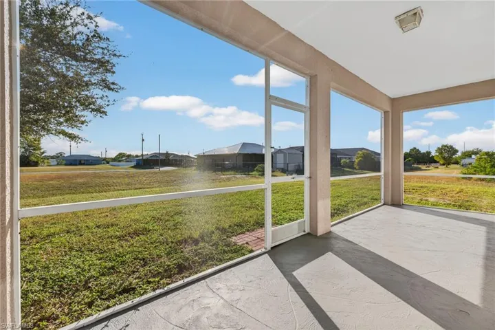 Unfurnished sunroom with a residential view