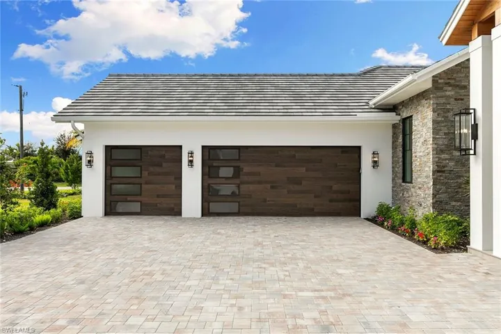The home features 5 full garage spaces