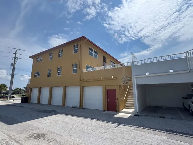 Right side of property with second stairwell for easy access from the beach.