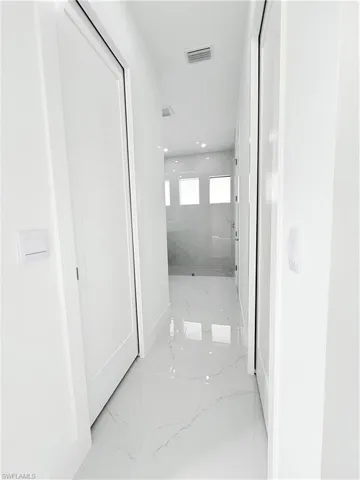 Corridor with marble tiled floors