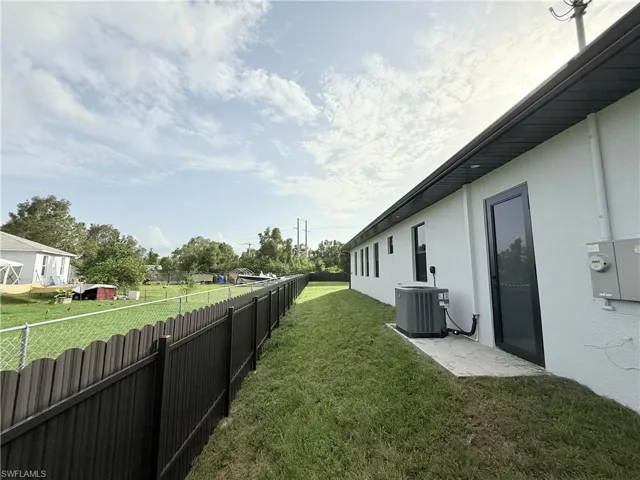 View of yard featuring cooling unit