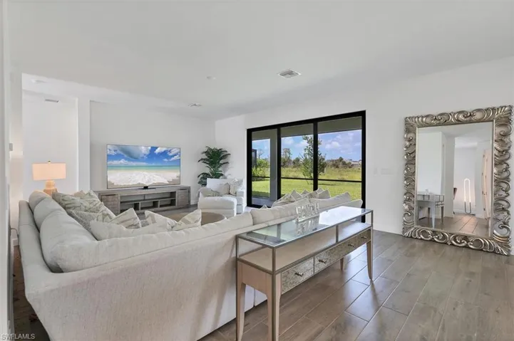 Living area featuring wood finished floors and baseboards