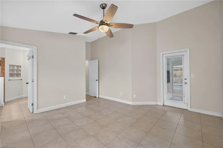 Primary Bedroom with view of on-suite bathroom and Entrance to the Pool Area
