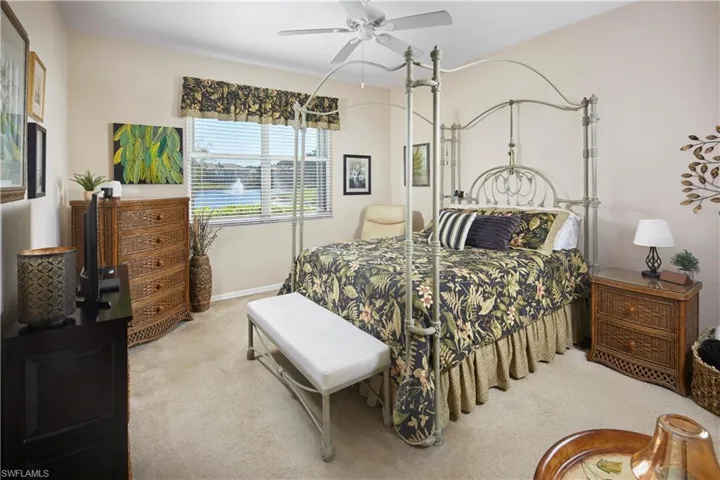 Large primary bedroom suite with lake view.