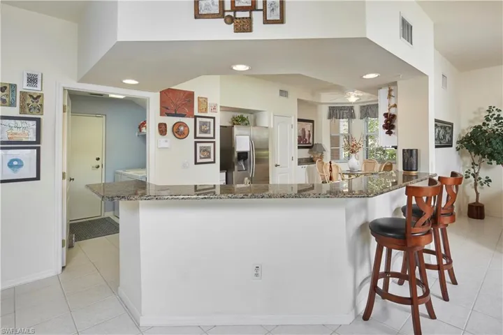 Living, dining and kitchen open to one another.