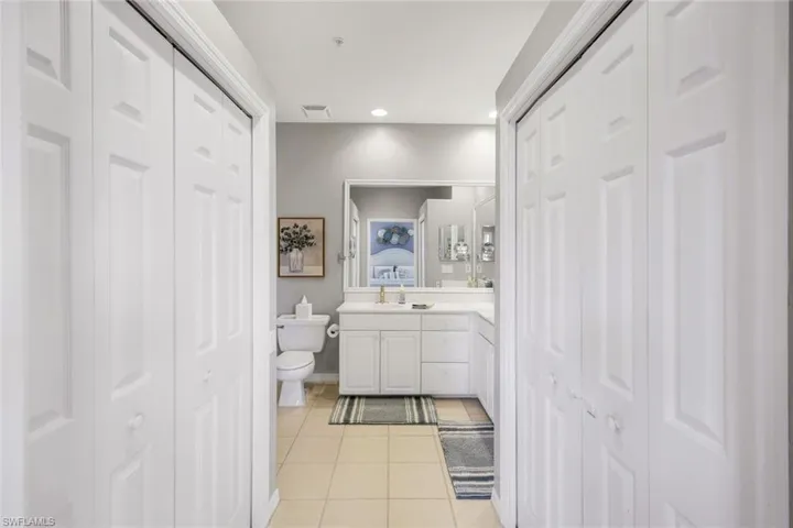 Bathroom with tile patterned flooring, vanity, and toilet