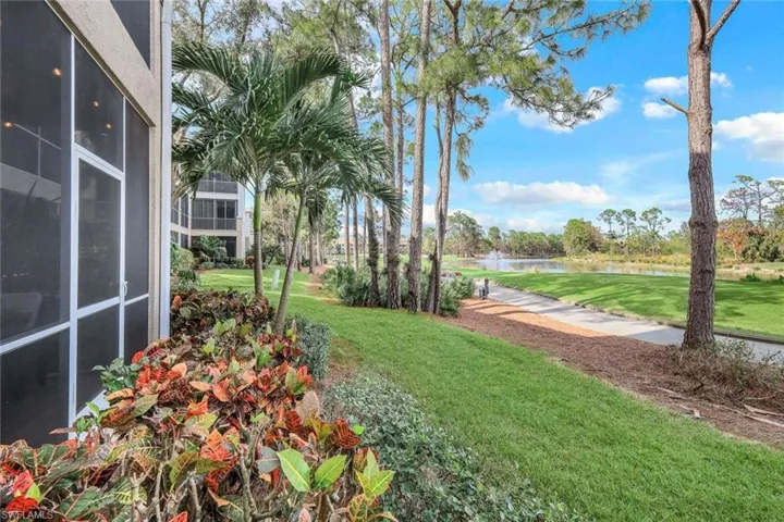 View of yard with a water view