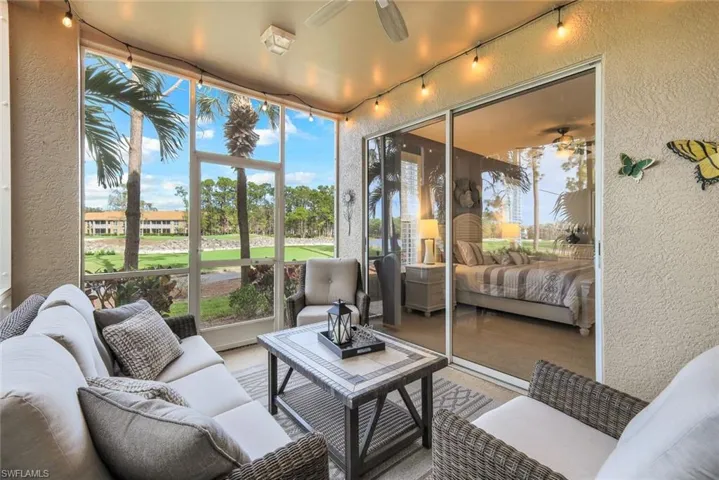 Sunroom / solarium featuring ceiling fan