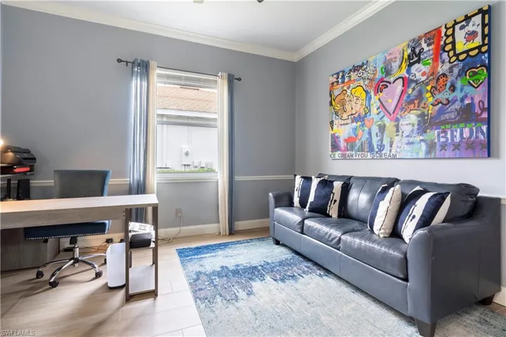 Home office featuring crown molding