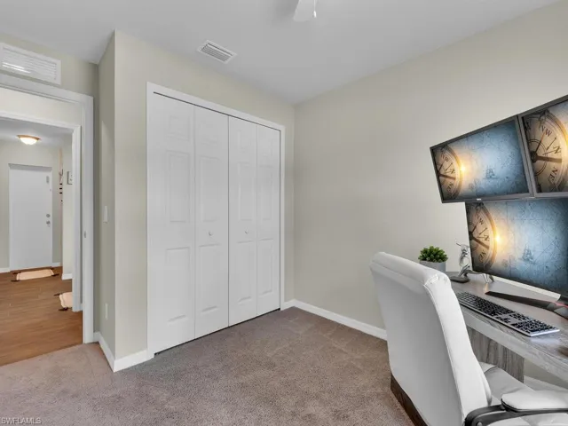 Living room featuring lofted ceiling, light wood-style flooring, and a ceiling fan