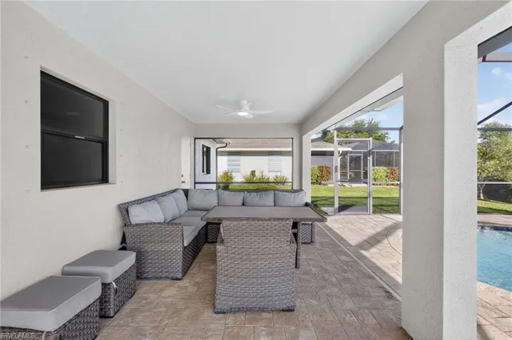 Sunroom with an outdoor hangout area and a ceiling fan