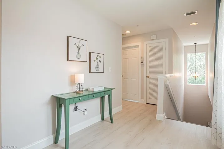 Hall featuring light wood-style floors
