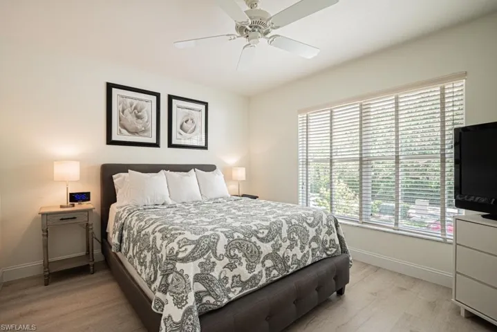 Second Bedroom with light hardwood / wood-style flooring and ceiling fan