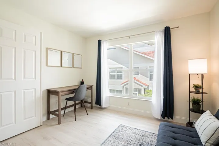 Home office/den with light wood-type flooring