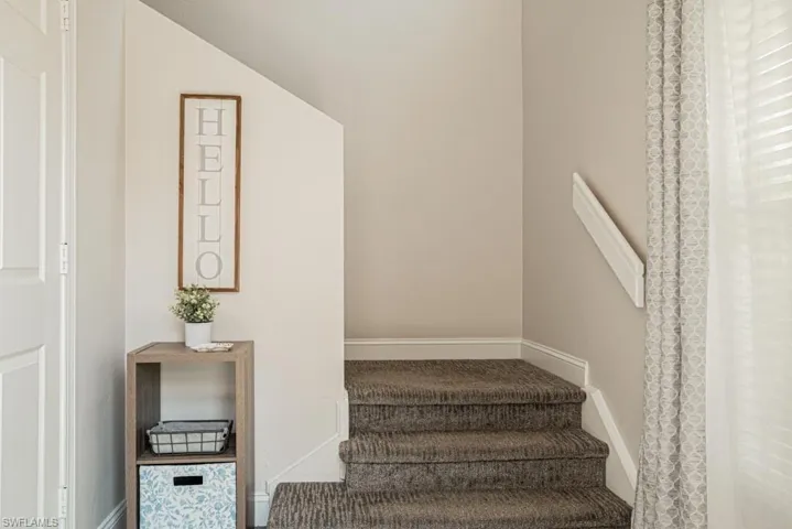 Staircase with vaulted ceiling
