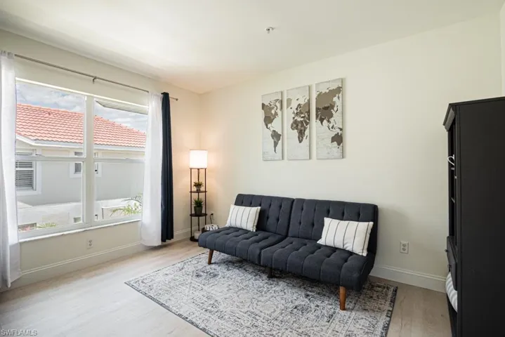 Den with wood-type flooring