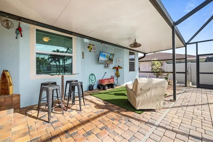 View of patio / terrace with ceiling fan and a lanai