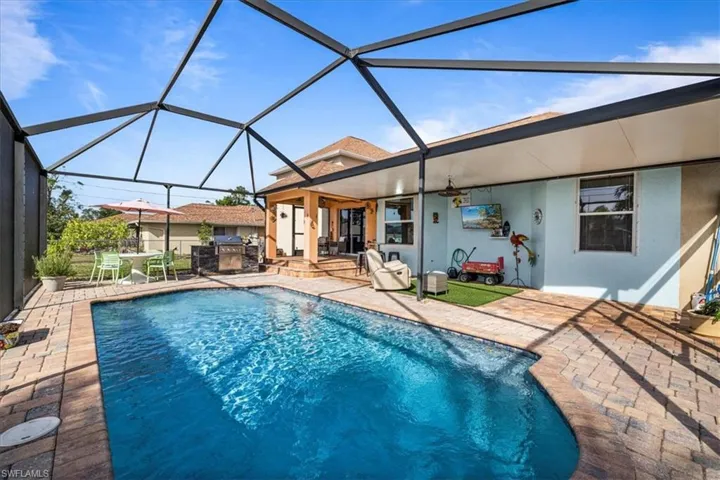 View of pool featuring a patio and a lanai