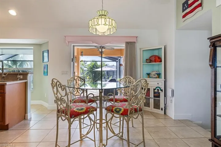 Dining room featuring ceiling fan and light tile patterned floors